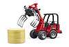 Schaffer Hoflader 2630 con forca per balle e 1 bal