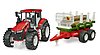 Trattore ROADMAX con rimorchio forestale e 3 tronchi