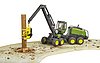 John Deere 1270G harvester with one tree trunk