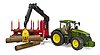 John Deere 7R con rimorchio forestale e 4 tronchi