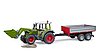 Fendt Vario 211 con caricatore frontale e rimorchio