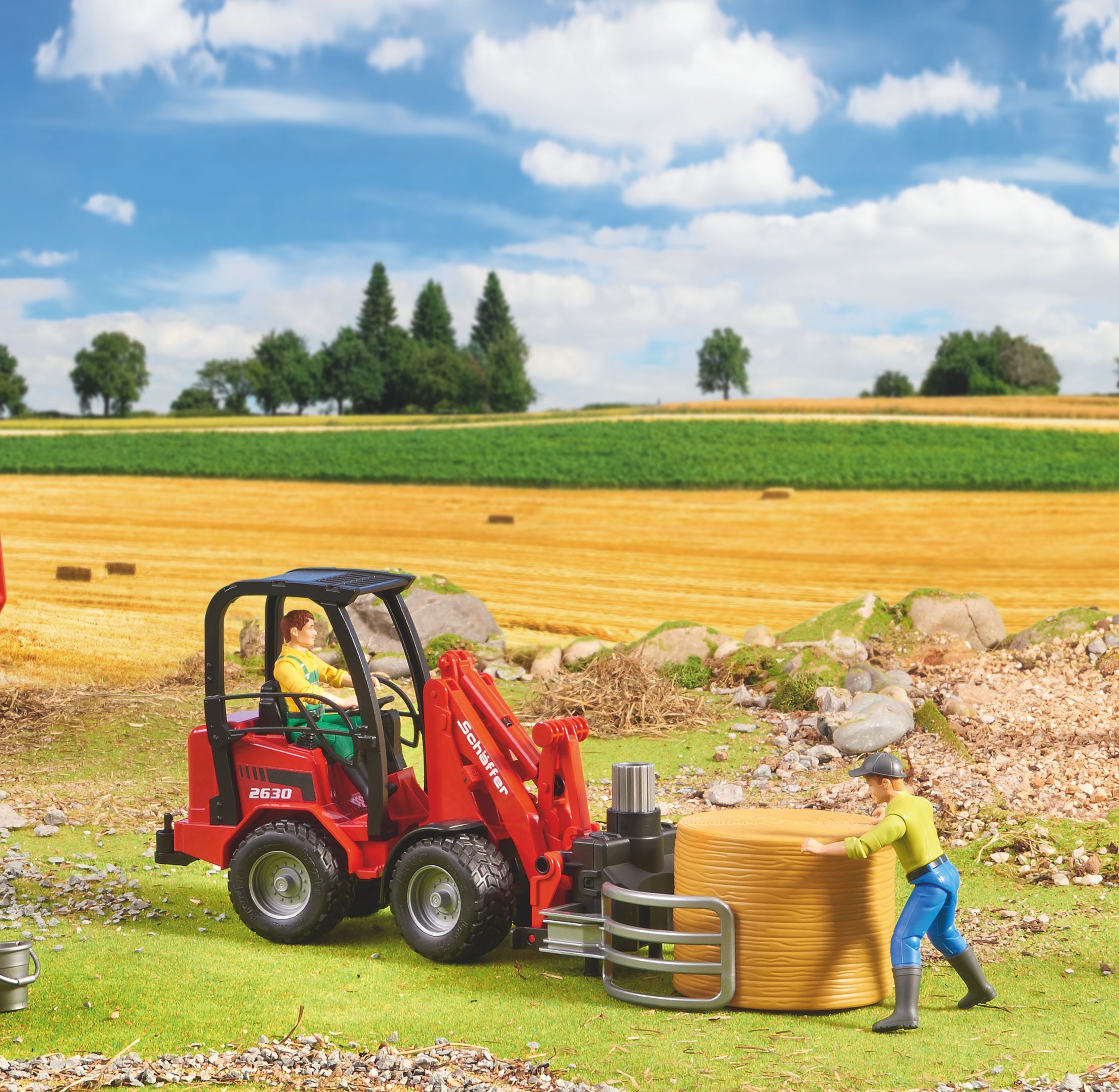 Schaffer Hoflader 2630 con forca per balle e 1 bal