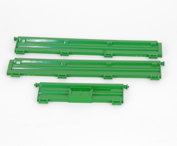 Ground side plates for tandem axle trailer